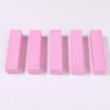 A row of five pink nail buffer blocks arranged horizontally on a white background.