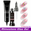 A tube of Rhinestone Glue Gel and a syringe applicator with several pink nails decorated with rhinestones