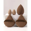 A set of five brown makeup sponges arranged on a white box.