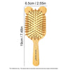 A wooden bamboo hair brush with numerous bristles for detangling and scalp massage.