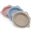 A set of three silicone makeup brush cleaner and drying stands in pink, blue, and beige.