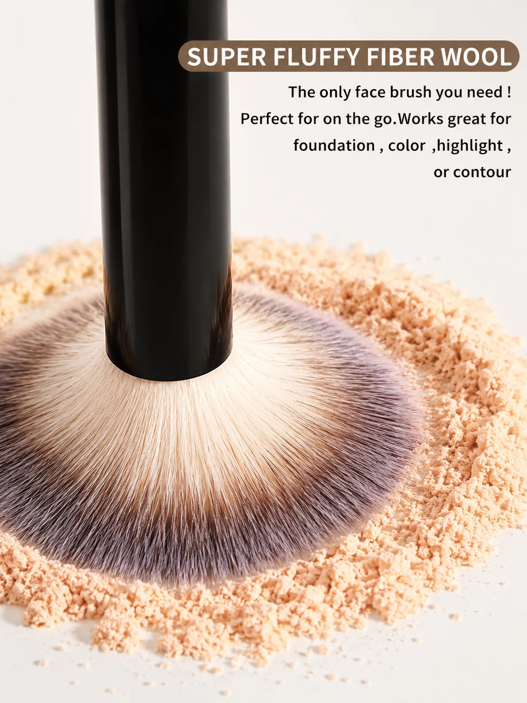 A close-up of a black makeup brush with soft bristles is shown above a mound of light pink cosmetic powder.