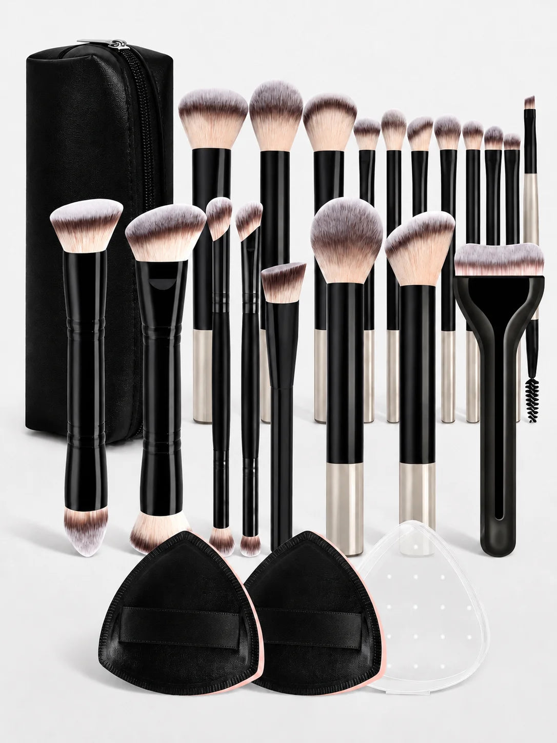 A collection of black and silver makeup brushes with soft bristles displayed next to a black zippered case and silicone pads.