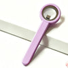A pink magnetic nail art stick with a clear top is shown against a white background.