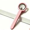 A pink magnetic cat eye nail art stick with a clear ring is shown against a white background.