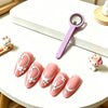 A set of pink magnetic nail art sticks featuring white floral designs and a purple magnifying tool.