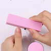 Hands demonstrate how beginners can easily use a pink nail buffer block for smoothing and polishing.