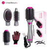 Set aus rosa und silberner elektrische Heißluftpinsel für Haartrockner mit schwarter Silikonhandschuh.