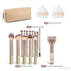 A set of makeup brushes and a powder puff including a brush bag and a curved foundation brush