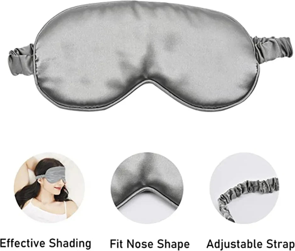 Masque de sommeil en soie grise avec sangle réglable, montrant son ajustement et son ombrage.