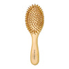 A light wood bamboo hair brush with numerous fine bristles for detangling and scalp massage.