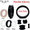 Various silicone ear tunnel plugs in flesh, black, clear, and white colors shown with size markings.