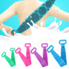 A hand is using a silicone body scrubber and massage brush on the back, with various colored silicone scrubbers displayed bel