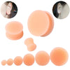 A collection of flexible silicone double flared ear tunnels in various shades of peach and nude.
