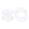 A pair of white flexible silicone ear tunnels and plugs.
