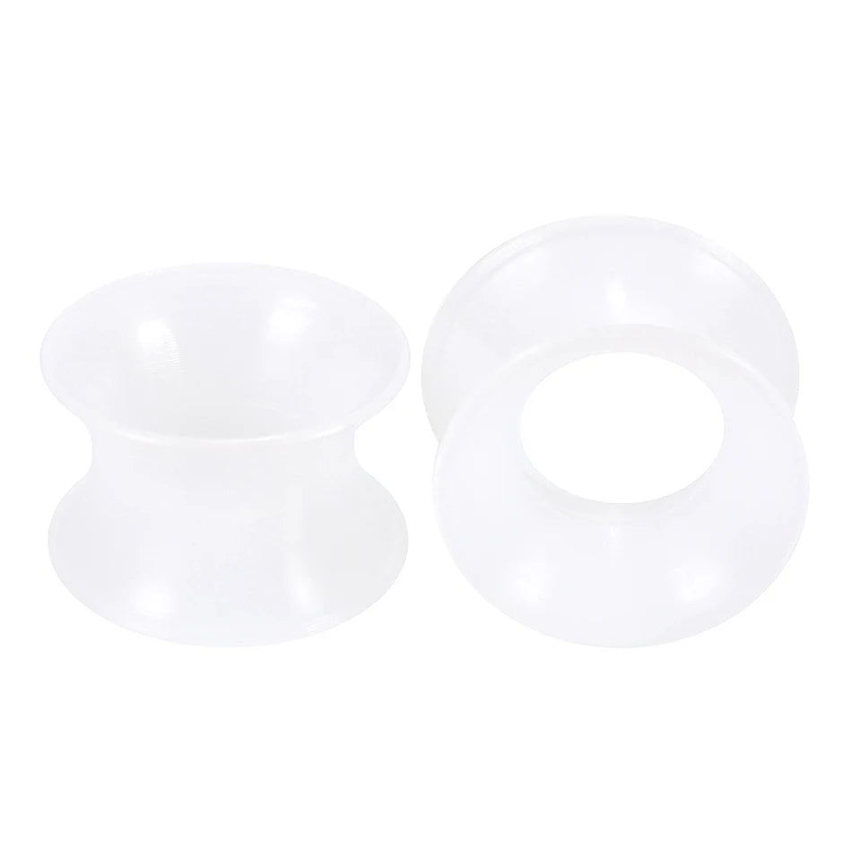A pair of white flexible silicone ear tunnels and plugs.