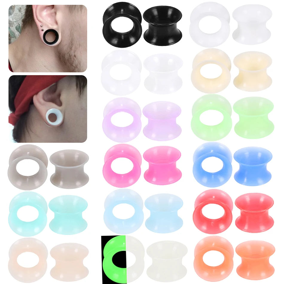 A variety of flexible silicone ear tunnels and plugs in various colors including black, white, pink, green, blue, red, and or