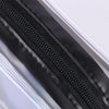 Close-up of a clear waterproof travel cosmetic bag with a black zipper detail.