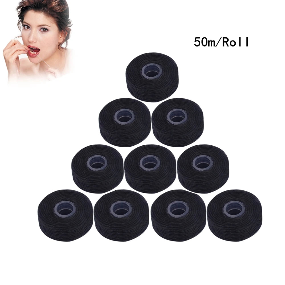 Una colección de 10 rollos de hilo dental negro, empaquetados para la venta.