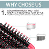 Close-up view of a black hot air brush with nylon pins and tufted bristles used for styling hair.
