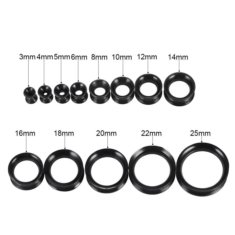 A set of black silicone ear tunnels and plugs in various sizes ranging from 3mm to 25mm.