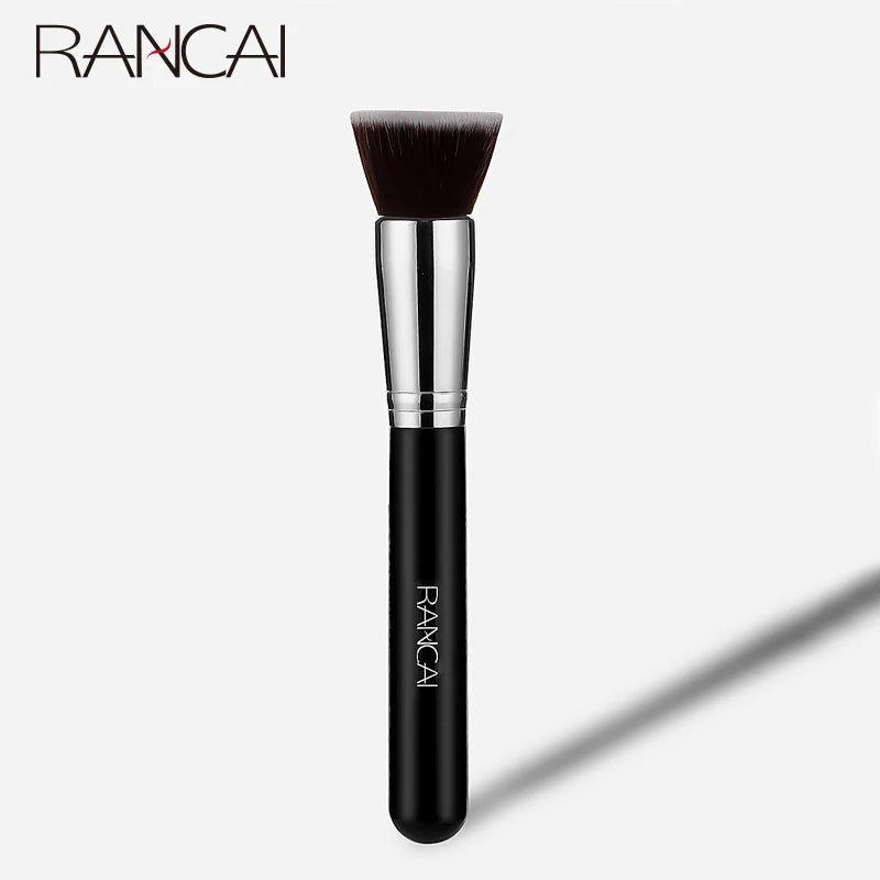 A silver flat top kabuki foundation brush with a black handle and dark bristles.