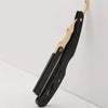A black and gold professional straight edge barber razor shown in profile against a white background.