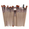 A collection of 20 professional makeup brushes in various sizes and shades arranged horizontally.