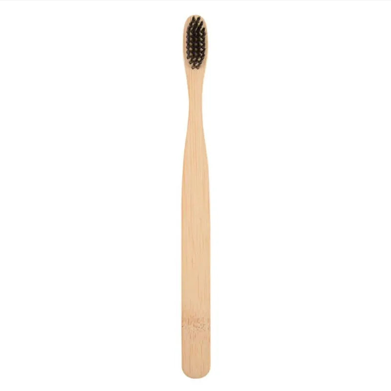 A natural bamboo toothbrush with light wood color and bristles shown vertically.