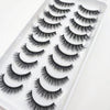A display of natural 3D mink false eyelashes in various styles arranged in a white tray.