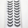 A plastic tray holding a set of natural mink false eyelashes in various styles and lengths.