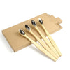 A set of bamboo toothbrushes packaged in a brown cardboard box.
