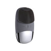 A gray sonic facial cleansing brush with a textured head and a silver base.
