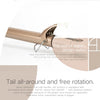 A close-up of a rose gold electric hair curler showing its stability design and safety features.