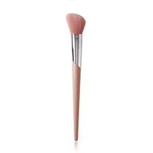 A pink angled cheek blusher makeup brush with a silver ferrule and tapered handle.