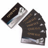 A set of QSHAVE and OSHAVE titanium blades for double edge safety razors, packaged in black boxes.