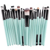 A collection of 20 professional makeup brushes with various shapes and sizes in light mint green and black.