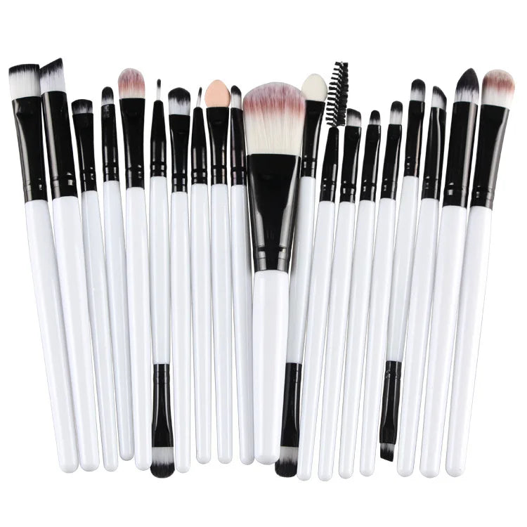 A collection of 20 professional makeup brushes with black and white handles and various hair-like bristles.