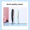 A black and light green folding straight razor shaver is shown against a white background.