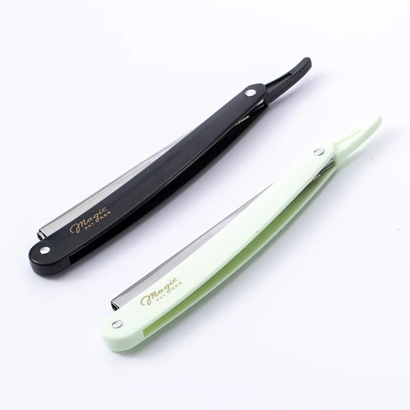 A pair of folding straight razor shavers, one black and one light green, shown diagonally on a white background.