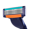 A close-up view of a precision replacement razor blade head with a teal colored strip and silver blades.