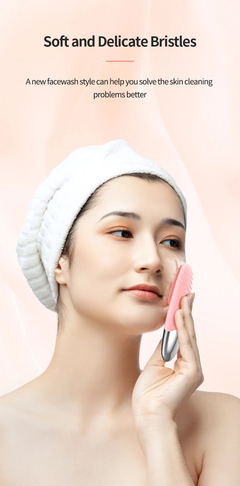 A woman is using a pink sonic facial cleansing brush on her face while wearing a white towel.