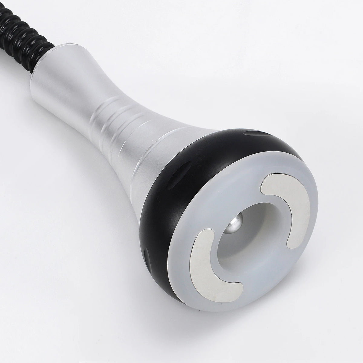 A silver and black ultrasonic body sculpting massager with a textured handle and a round head.
