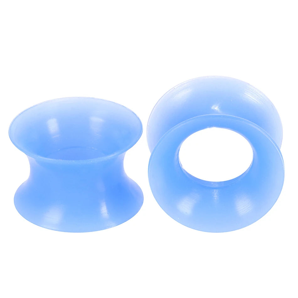 A pair of light blue flexible silicone ear tunnels and plugs.