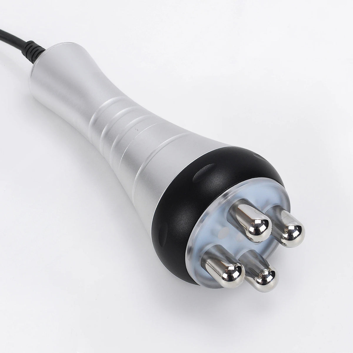 A silver and black ultrasonic body sculpting massager with multiple metal prongs visible at the end.