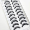 A plastic tray filled with various styles of black mink false eyelashes for eye makeup.