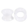 A pair of white flexible silicone ear tunnels and plugs.
