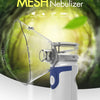 A white portable nebulizer device with a clear mask is shown against a green, leafy background.