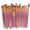A collection of 20 professional makeup brushes in various shades of pink and nude.
