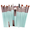 A collection of 20 professional makeup brushes in various sizes and shades arranged horizontally.